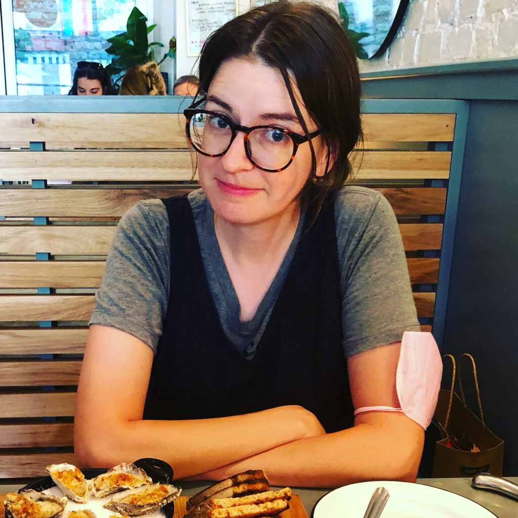 Rahija smiling with oysters.